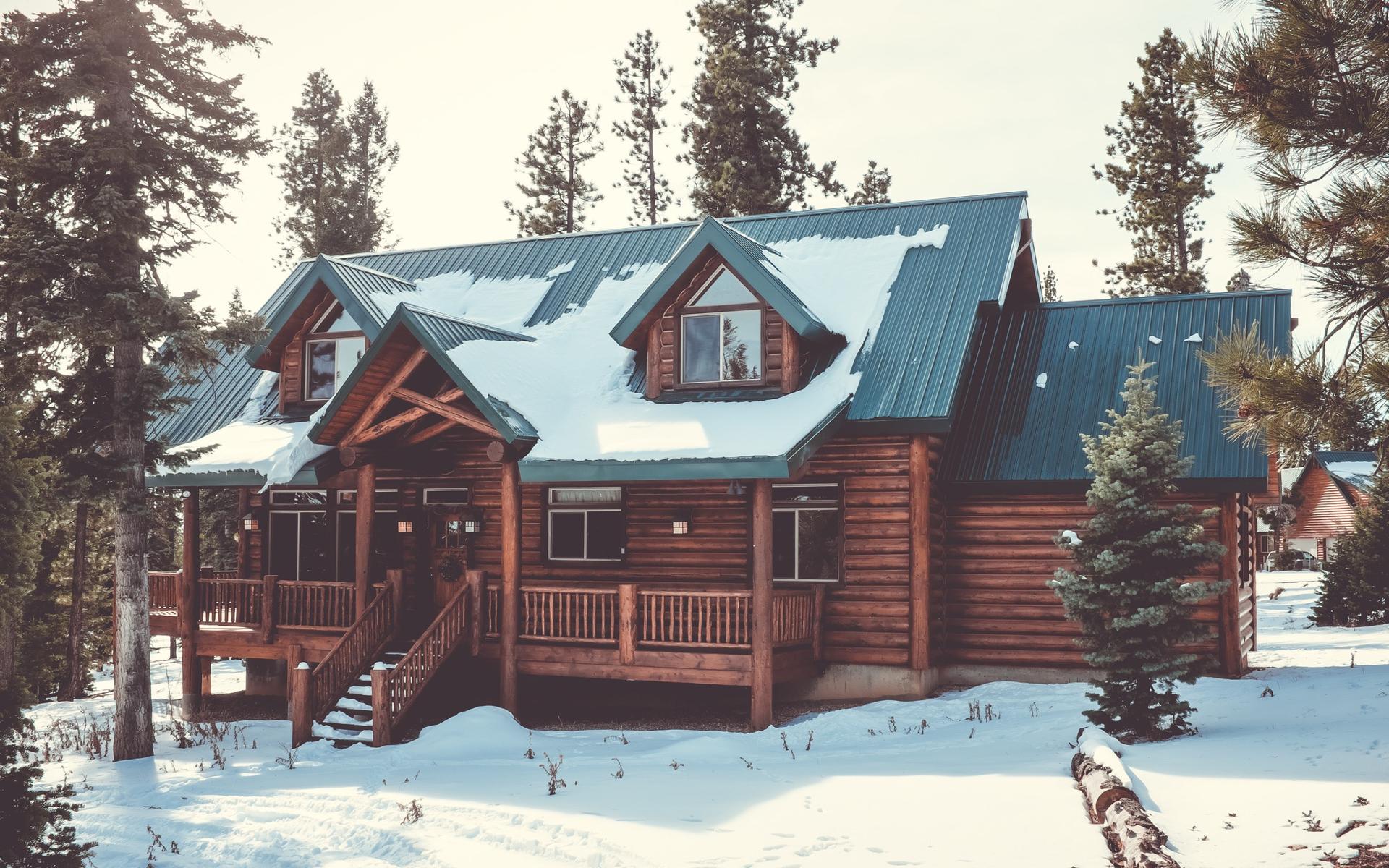 Mountain cabin with a steep pitched roof in high-country conifer forest, Eagle Point Beaver County Utah solar and battery backup